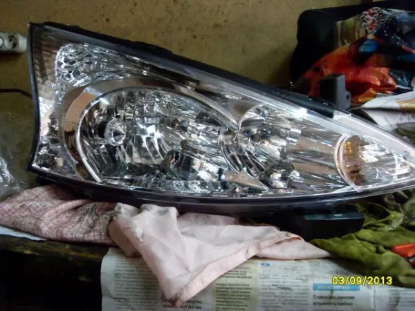 Luz esquerda Mitsubishi Grandis NAW