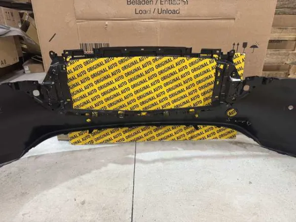 Pára-choque dianteiro, parte superior KSD550031ABB Mazda