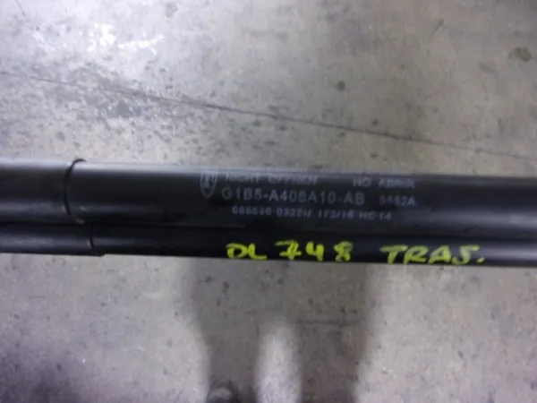Amortecedor de tampa de porta-malas (de 3ª/5ª porta traseira) G1B5A406A10AB Ford